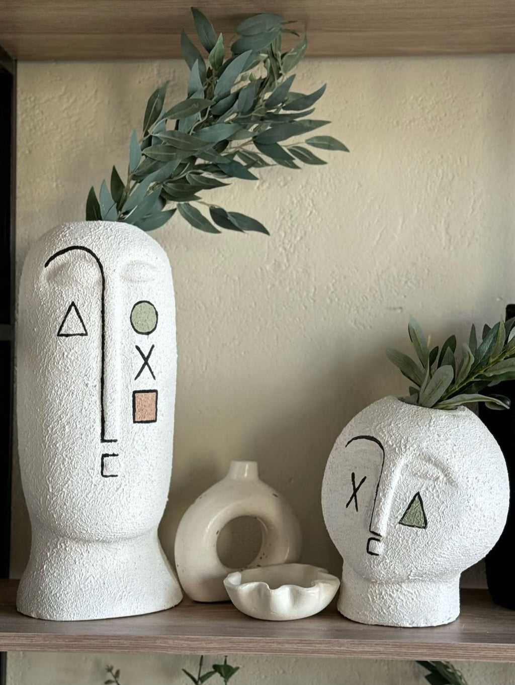 Two pottery art face vases 